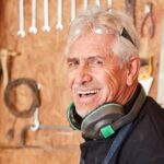 A Master Woodwork Polishes His Woman A master woodworker skillfully polishes his woman, achieving a smooth finish