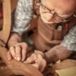 Woodworker crafting unique pieces for profit, demonstrating how you can make money doing woodworking