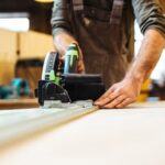 What Is a Joiner in Woodworking Image of a Joiner in woodworking crafting a joint with precision using specialized tools