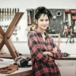 Image of a professional woodworker using the lathe machine with precision and skill