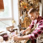 Automated Woodworking Machines Image of automated woodworking machines efficiently carving wood benches in a workshop