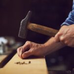 Start Woodworking Business Entrepreneur starting a successful woodworking business with high-quality wooden furniture and custom designs