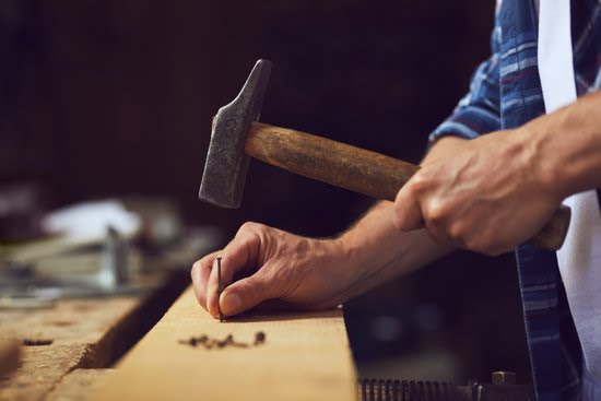 Start Woodworking Business 3 Entrepreneur starting a successful woodworking business with high-quality wooden furniture and custom designs