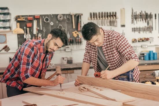 Essential tools and materials for making a woodworking table, including saws, screws, and sturdy wooden planks