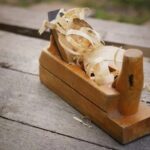 What Are the Most Important Machines for a Woodworking Shop A collection of essential woodworking machines, including table saw, bandsaw, planer, and router