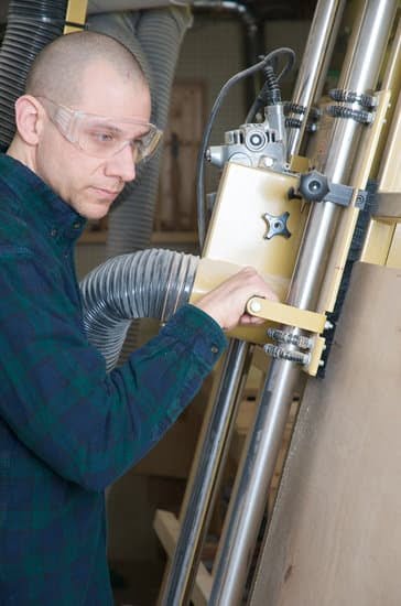 Close up of ceiling woodwork showing visible cracks caused by moisture and structural movement