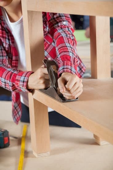 Woodworker finding the book in workshop filled with tools and sawdust