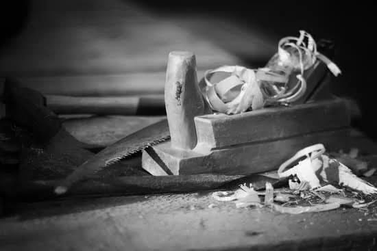 Do Woodwork 1 Man working on intricately carved woodwork masterpiece with various hand tools and wood materials