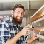 Fancy woodworking: intricate hand-carved details on mahogany bed frame