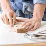 What Is Woodworking Panel Saw Close-up of woodworking panel saw in action, cutting through large piece of lumber