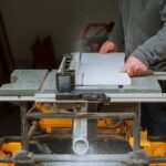 How to Keep Dust to a Minimum in Woodworking Shop Woodworking shop with dust collection system for minimal dust during operations