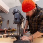 Using a gentle solution of vinegar and water to remove fresh paint from woodwork