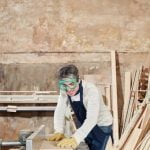 Woodworking router used for shaping and cutting wood, essential for creating joints and edges