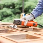 Is Mark Harmon Really a Woodworker Photo of Mark Harmon working with wood in his workshop, displaying his passion for woodworking