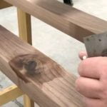 What Is Shot Woodwork in Soccer Close-up of soccer ball hitting the goal post, illustrating 'what is shot woodwork in soccer'